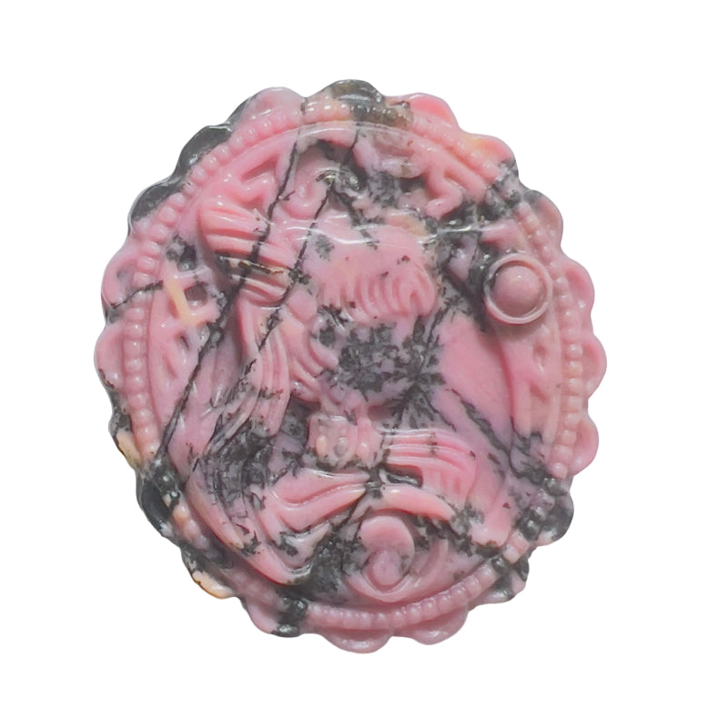 Side angle view of pink rhodonite crystal carving showing depth and dimension
