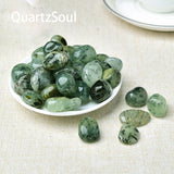 Collection of polished Prehnite tumbled stones showcasing various shades of green healing crystals