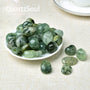 Collection of polished Prehnite tumbled stones showcasing various shades of green healing crystals
