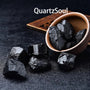 Premium grade raw Black Tourmaline stones arranged to show natural crystal formation and size