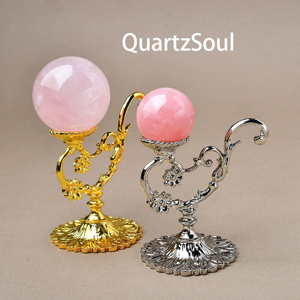 Elegant gold crystal ball display stand holding clear quartz sphere for home decor