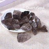 Premium smoky quartz raw crystal points arranged in white display bowl showing size variations