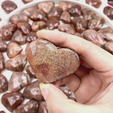 Bulk collection of goldstone crystal hearts for wholesale buyers