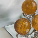 Closeup of Mica Inclusions in Honey Fluorite Sphere Wholesale Crystal