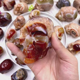 Carnelian crystal skull front view showing detailed carving