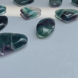 Rainbow fluorite palm stone polished for crystal healing wholesale