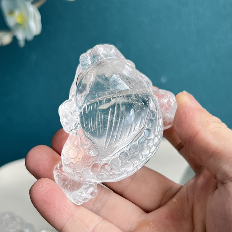 Size comparison of golden toad crystal carving