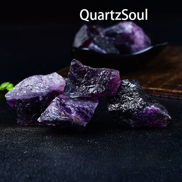 Natural raw purple fluorite crystal cluster with vibrant purple color healing properties