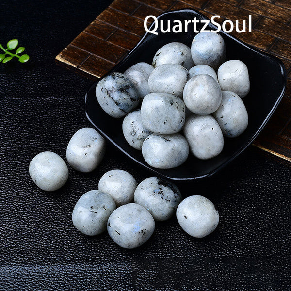 Rainbow Moonstone healing tumbled stones arranged in black bowl for crystal therapy