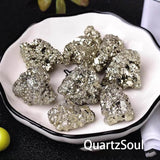 Raw pyrite stone specimens displayed on white plate