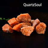 Natural raw sunstone crystal specimens with vibrant orange color and schiller effect