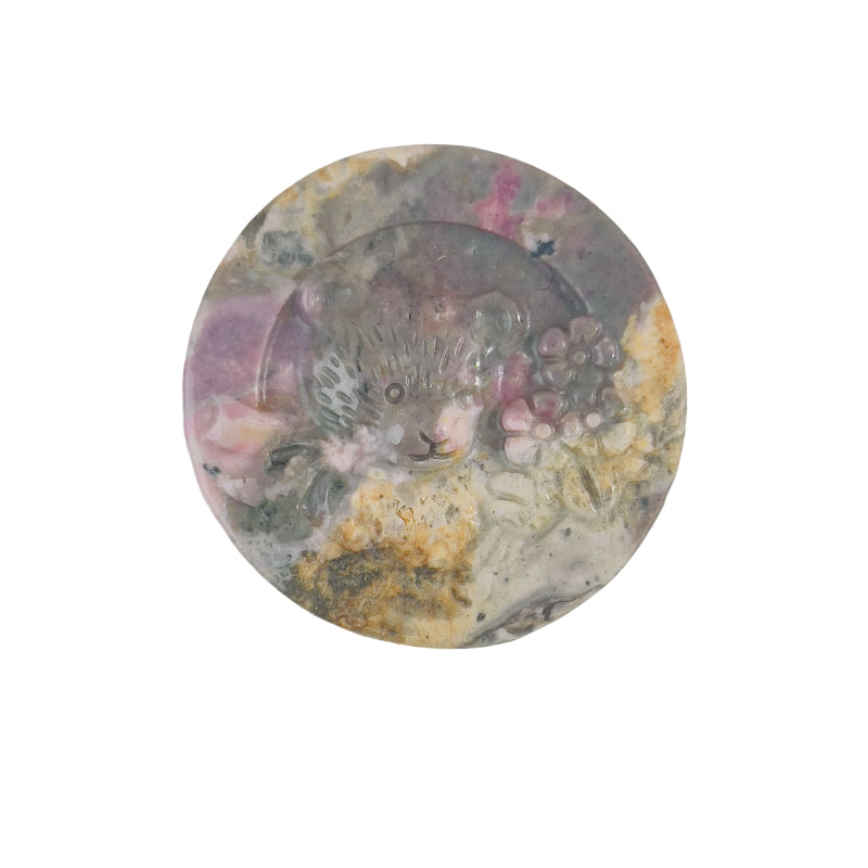 Color variation in natural rhodonite bear crystal carvings
