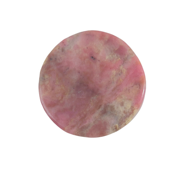 Light reflecting off polished rhodonite bear carving
