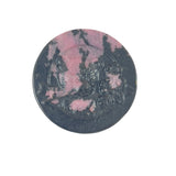Pink rhodonite bear carving featuring distinctive black manganese patterns