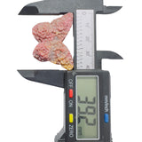Side profile of handcrafted rhodonite butterfly crystal showing natural stone texture