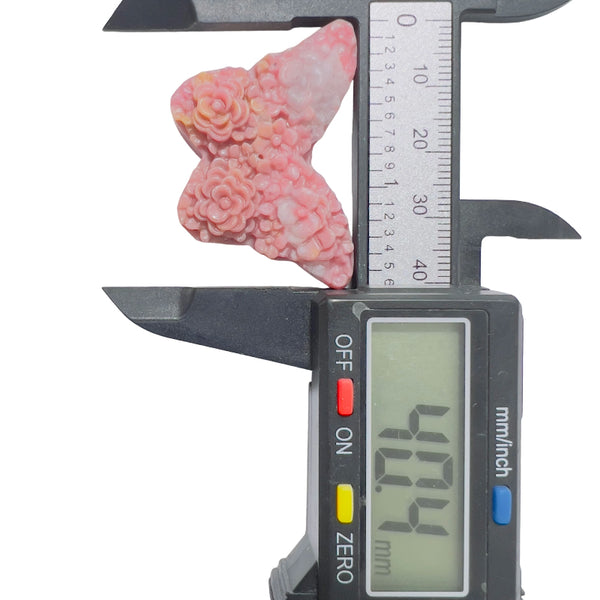 Pink rhodonite butterfly carving side angle wholesale crystal