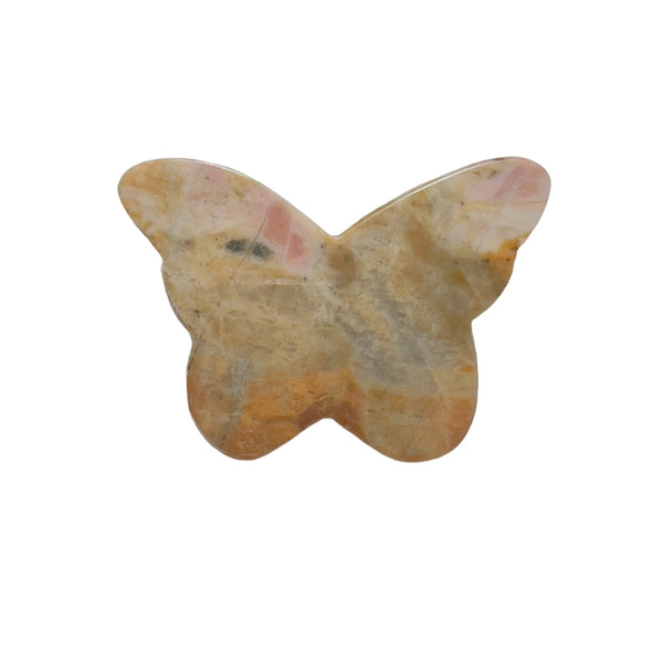 Side angle view of rhodonite butterfly crystal carving showing dimensional details