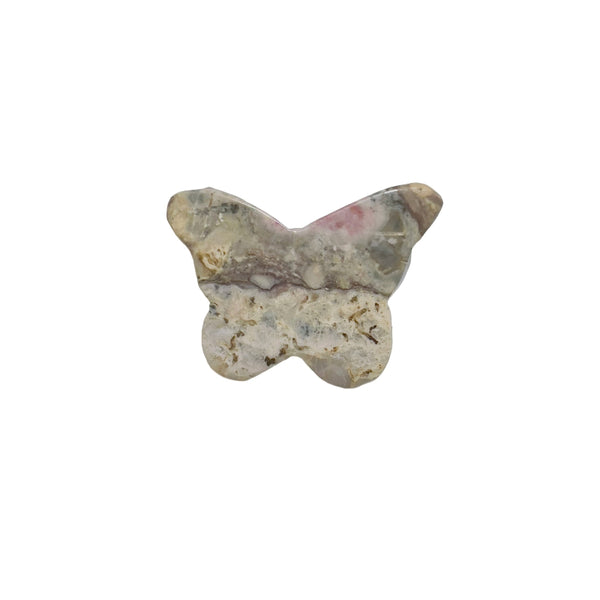 Butterfly Rhodonite carving in heart chakra healing arrangement