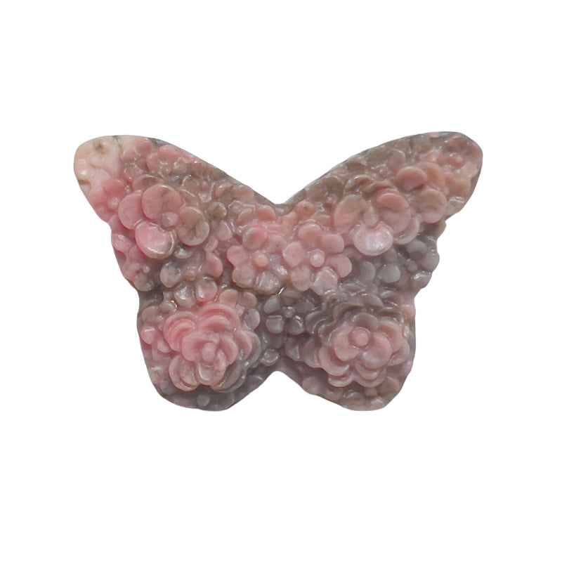 Close up of rhodonite butterfly crystal carving showing detailed pink crystal formations