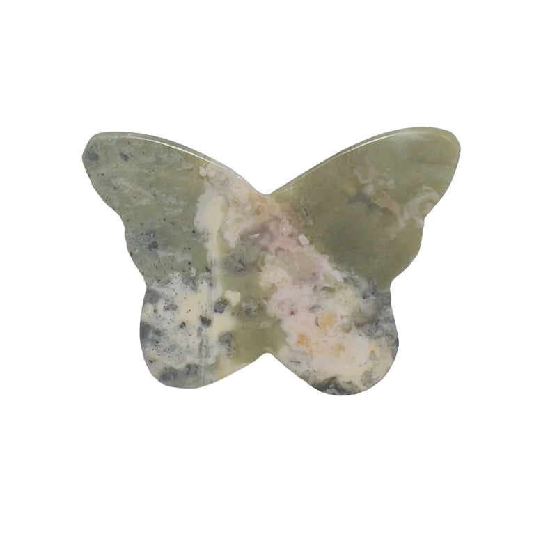 Side view of rhodonite butterfly carving showing natural crystal formation