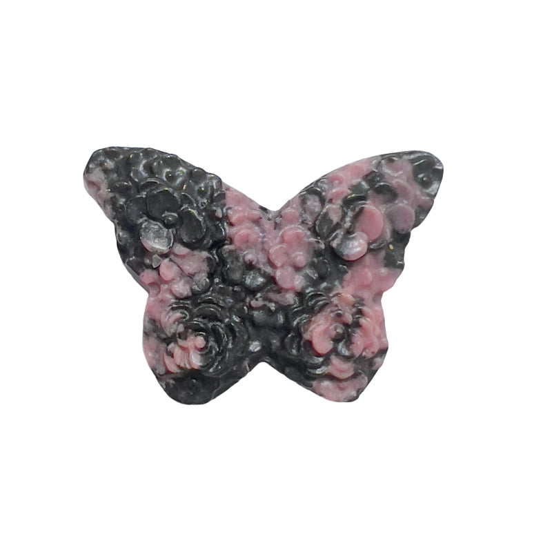 Palm-sized pink rhodonite butterfly carving highlighting the stone's natural beauty