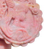 Detailed View of Rhodonite Crystal Disk Showing Intricate Carving Pattern