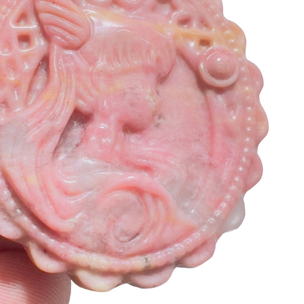 Detailed View of Rhodonite Crystal Disk Showing Intricate Carving Pattern