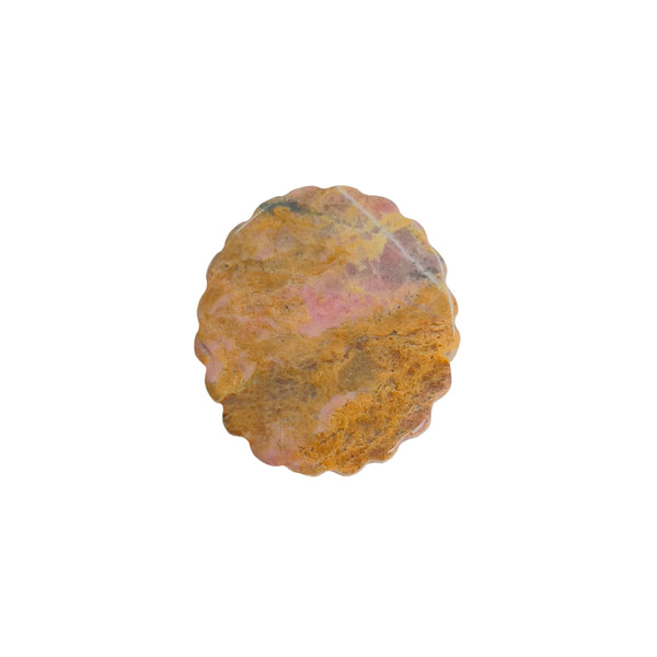 Pink rhodonite magical girl carving shown in palm for size reference