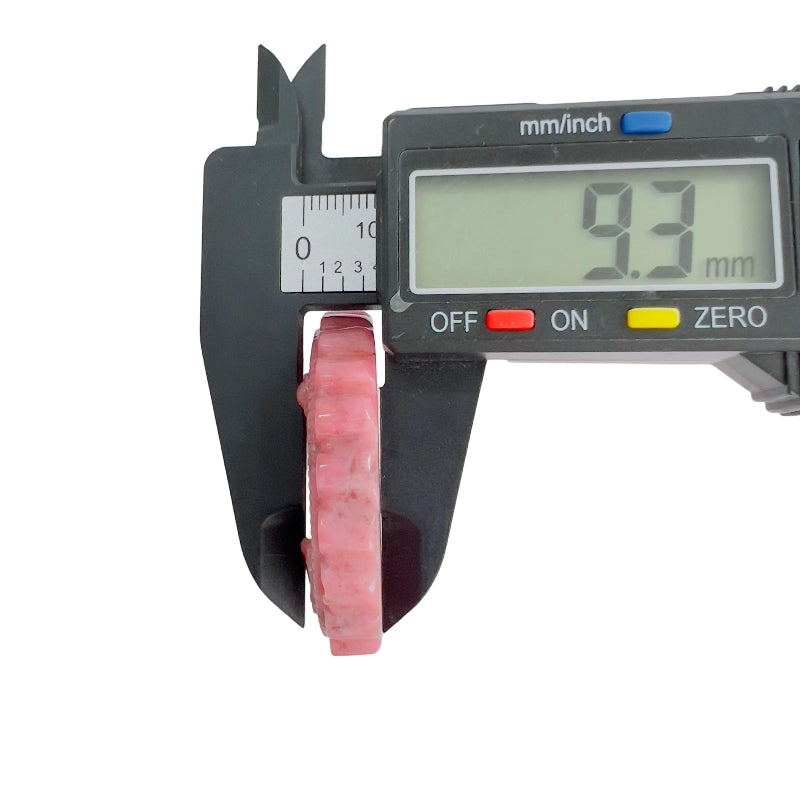 Pink rhodonite carved medallion thickness measurement