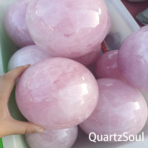 Rose quartz sphere showcasing natural patterns and wholesale quality