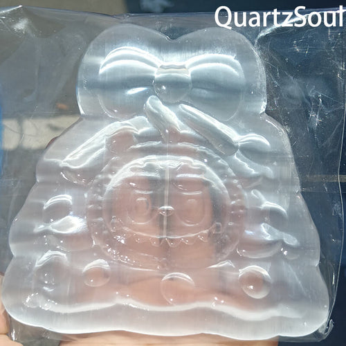 Handcrafted selenite crystal bunny carving with bow tie design