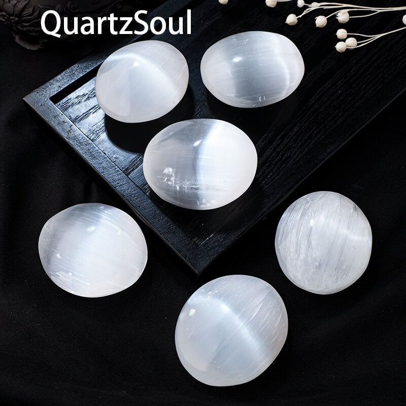 Selenite Palm Stone Crystal Held in Hand Showing Size and Texture