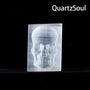Natural white selenite crystal skull palm stone with translucent glow