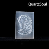 Selenite beauty palm stone being held to show scale and healing use