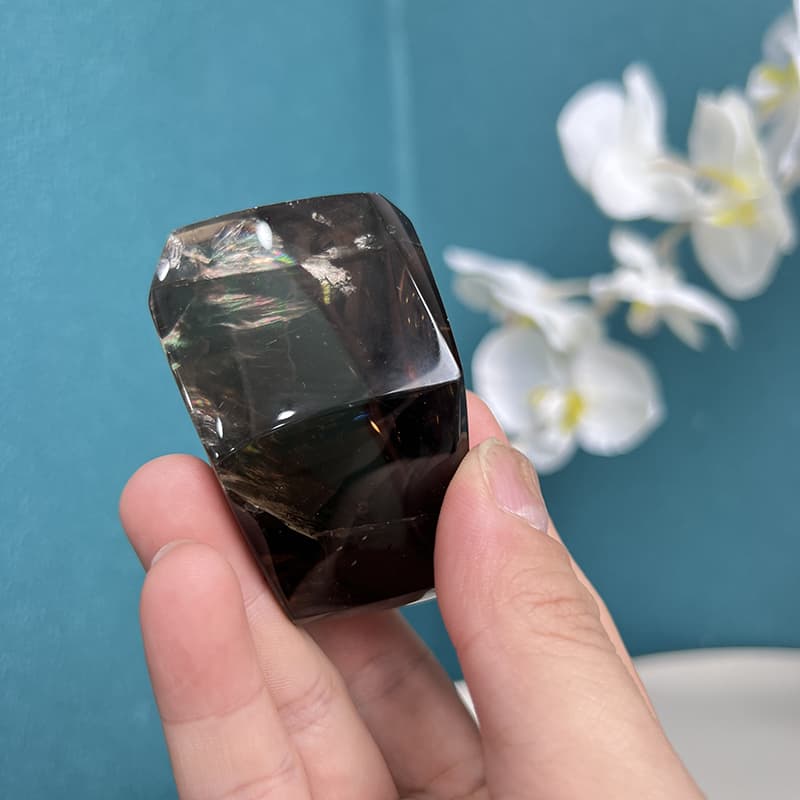 Polished surface of smoky quartz free form crystal showing deep coloration