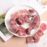 Premium Strawberry Quartz raw crystal chunks arranged in circular pattern