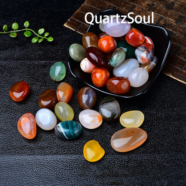 Premium polished tumbled stones displayed in a black bowl showing various crystal healing stones