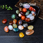 Premium polished tumbled stones displayed in a black bowl showing various crystal healing stones