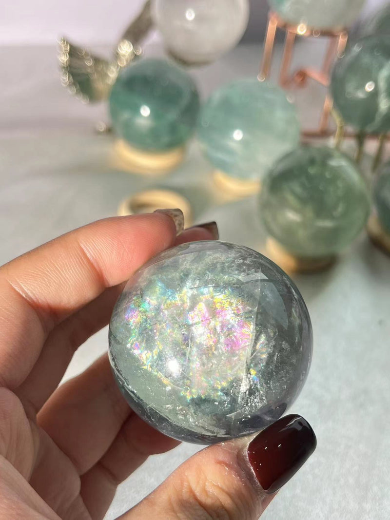 Wholesale collection of light green fluorite crystal spheres