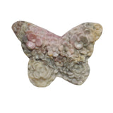 Group of Rhodonite butterfly carvings showing wholesale crystal variety