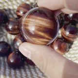 Close-up of Red Tiger's Eye Sphere Showing Natural Patterns