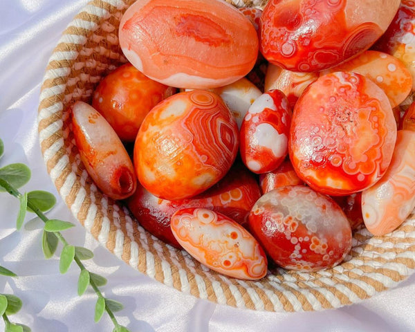 Polished Carnelian Palm Stone with vibrant orange patterns for meditation and healing