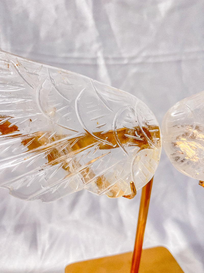 Crystal wings healing ornament on gold stand side view