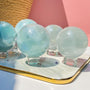 Light green fluorite crystal sphere with display stand