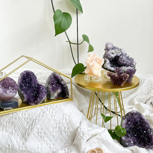Raw amethyst cluster showing natural purple crystal points