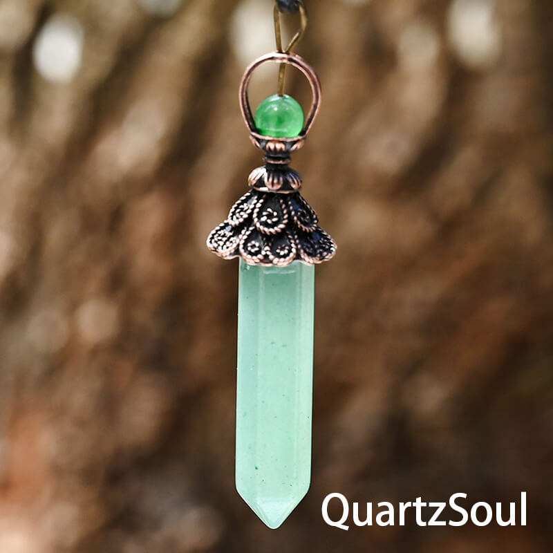 Green hexagonal crystal pendulum for spiritual guidance"