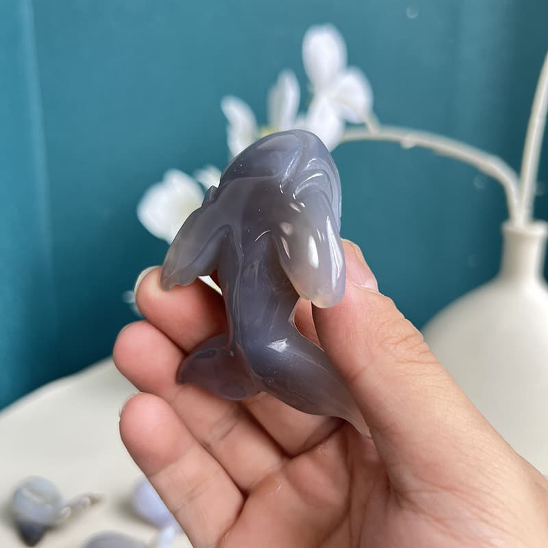 Natural agate crystal whale carving displayed as home decor
