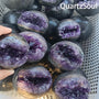 Collection of natural amethyst geode spheres for wholesale crystal suppliers