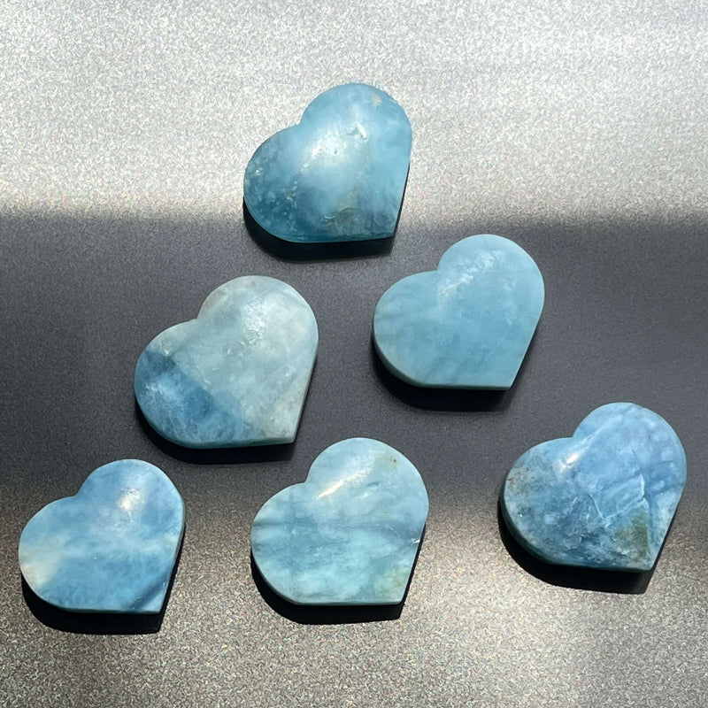 Aquamarine Heart Crystal Held in Palm