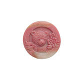 Front view of bear shape rhodonite carving showing detailed features